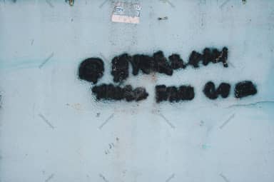 Pale Blue Wall Texture With Black Graffiti