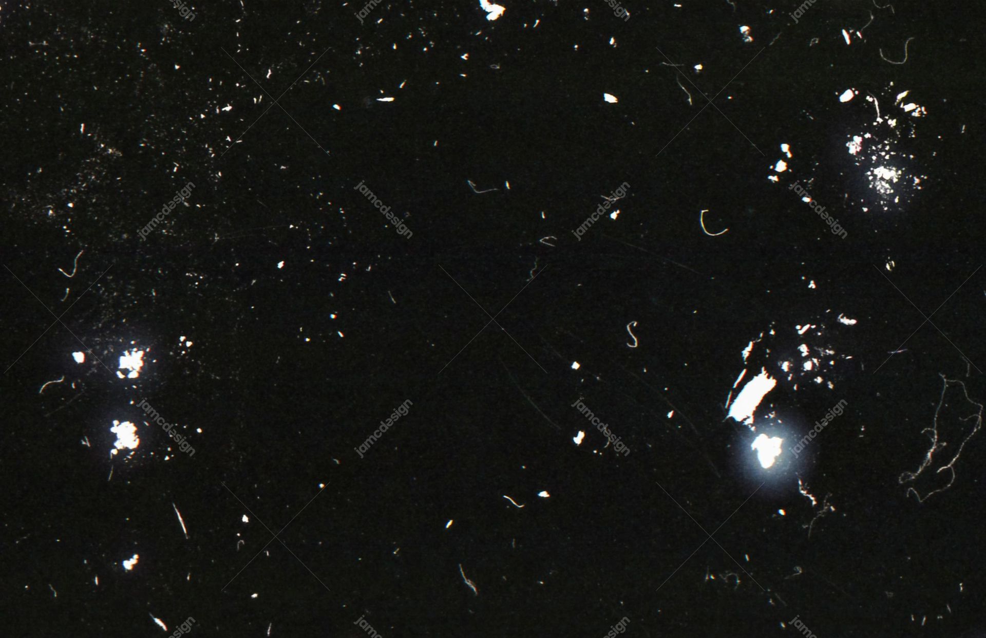 Black Glossy Speckled Texture Background. Download this black and silver JPG texture, with a glossy surface scattered with bright speckles