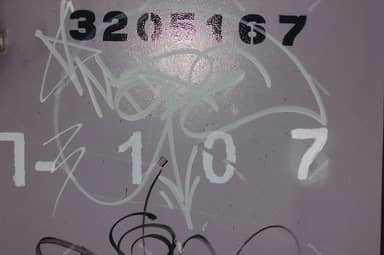 Rough Wall Texture With Pale Graffiti Strokes