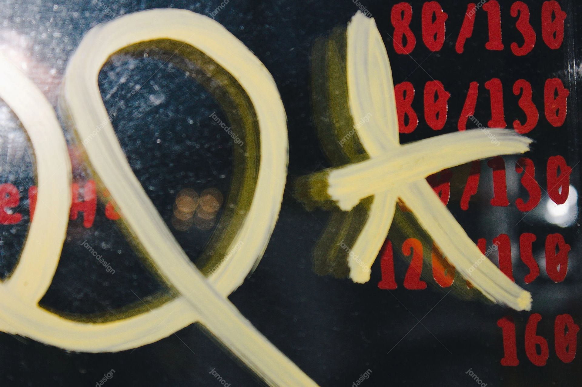Dark Texture With Yellow Graffiti Strokes. This JPG texture features broad yellow graffiti strokes over a dark, speckled surface marked with red numerals