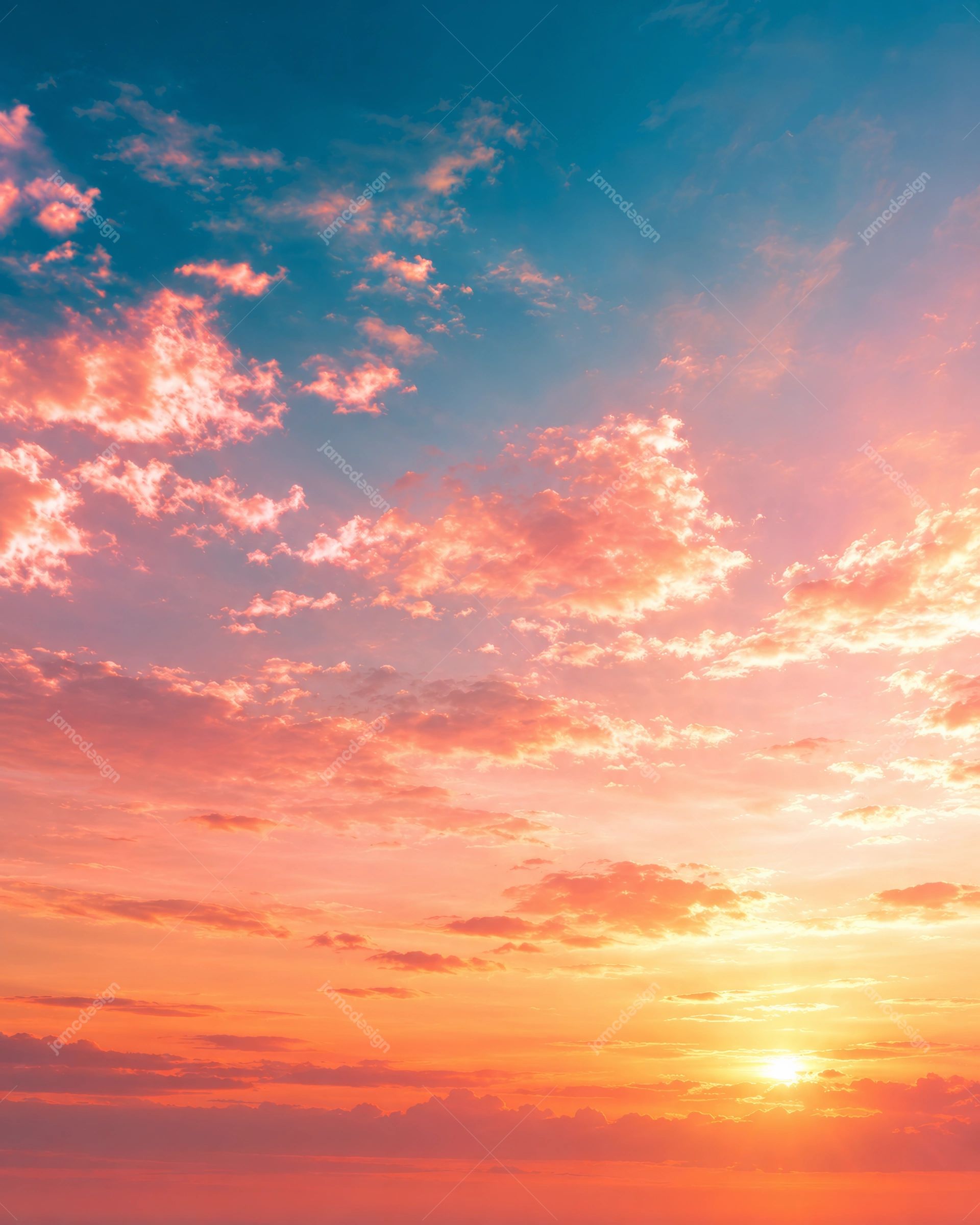 Coral Sunset Clouds Beneath A Blue Evening Sky Background PNG. This PNG background shows coral pink clouds across a blue sunset sky