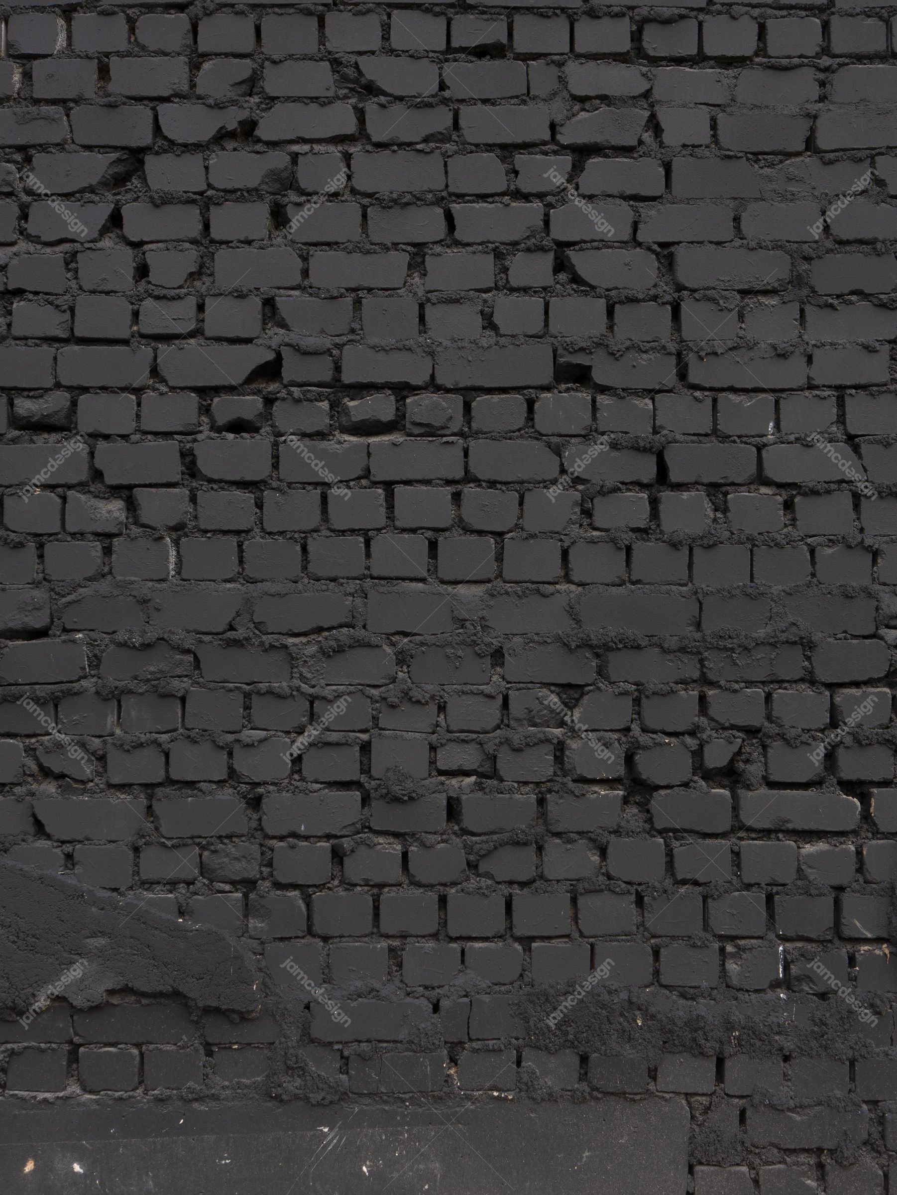 Dark Brick Wall Texture PNG. This PNG texture shows a dark, rough brick wall with uneven masonry and worn mortar