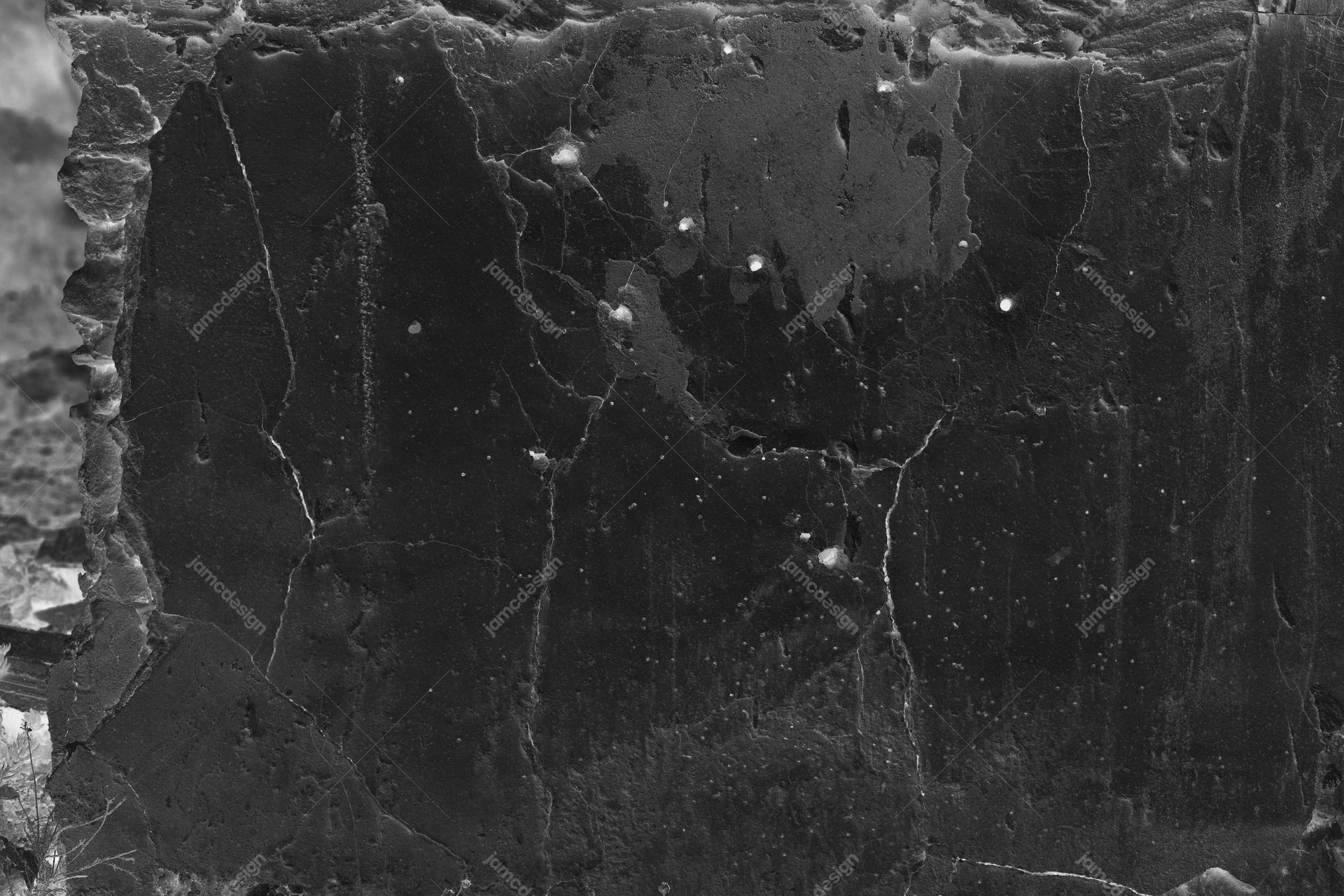 Dark Concrete Texture With Branching Cracks. Download this JPG concrete texture showing a dark, weathered surface with branching cracks