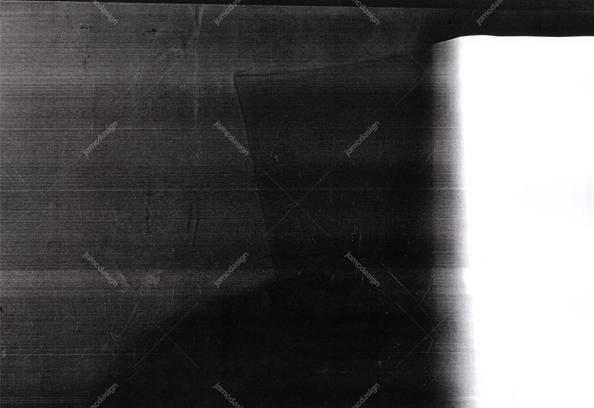 Dark Scratched Texture With White Edge Light Leak. This JPG texture pairs a dark, grainy, scratched surface with a broad white light leak along one edge