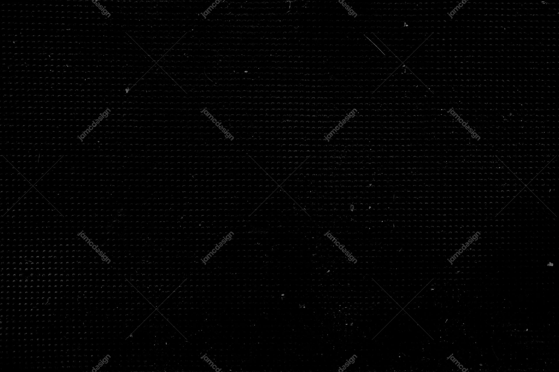 Dark Monochrome Texture With Dense Speckles PNG. This PNG texture has a near black surface with fine, closely spaced speckles and subtle grain