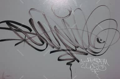 Gray Wall Texture With Sweeping Black Graffiti