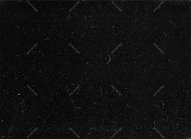 Dark Surface Texture With Sparse Gray Flecks