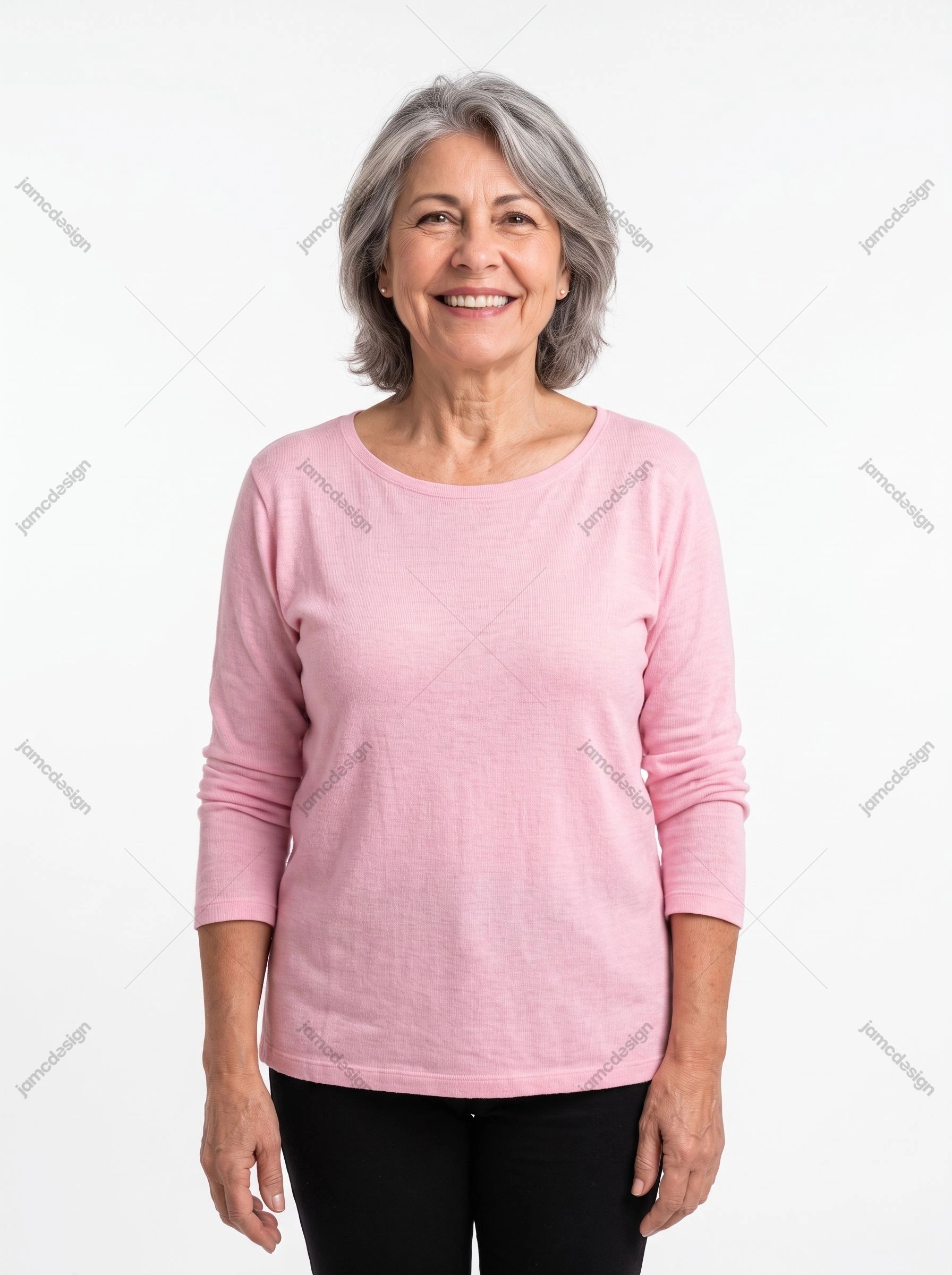 Smiling Mature Woman Studio Portrait. This JPG studio image shows a smiling mature woman in a pink shirt against a clean white background