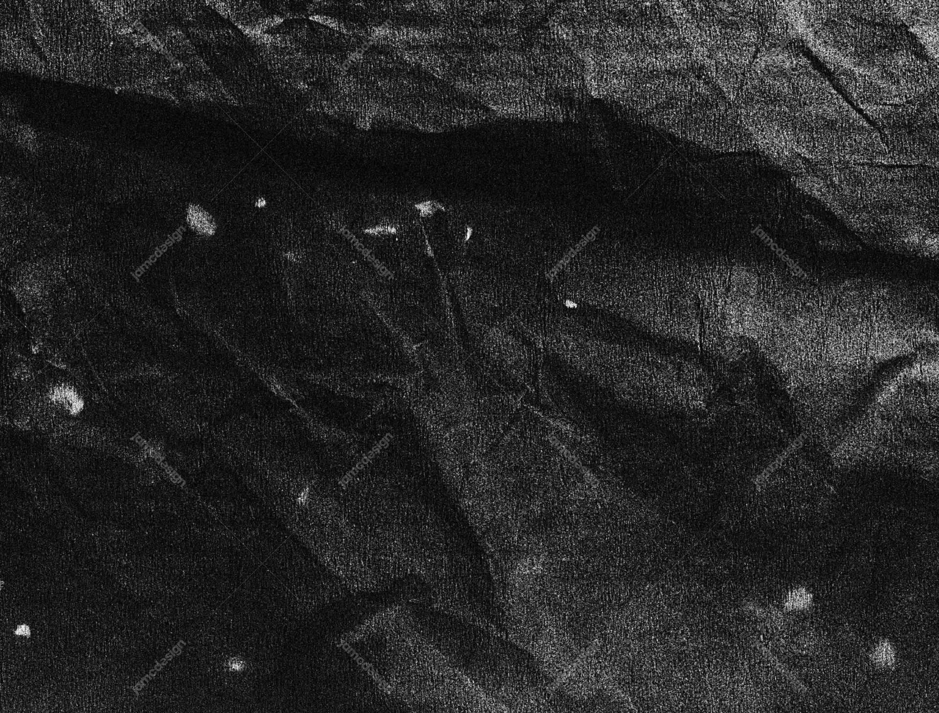 Dark Creased Paper Surface Texture. Download this JPG texture of black wrinkled paper, showing coarse monochrome grain and uneven creases across the surface