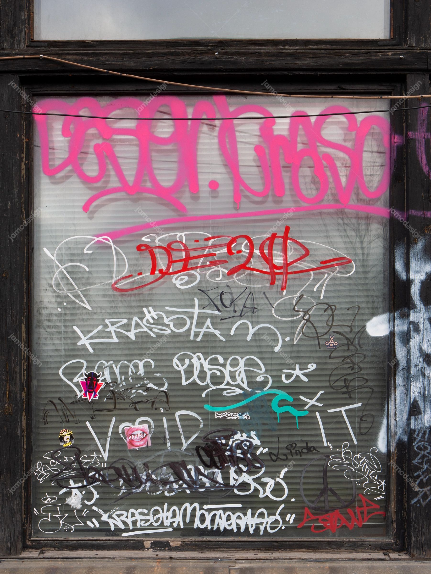Graffiti-Covered Ribbed Window Texture PNG. Download this PNG texture of a graffiti covered ribbed urban surface, framed by dark weathered wood and metal