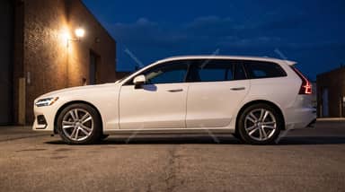 White Volvo V60 On An Industrial Street At Twilight