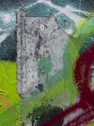 Distressed Concrete Texture With Vivid Graffiti Paint PNG