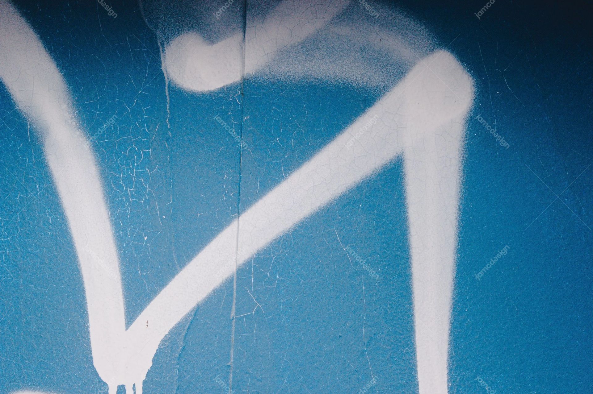 Turquoise Wall Texture With White Graffiti Strokes. This JPG texture shows a turquoise blue, scratched surface crossed by broad white paint strokes in a loose