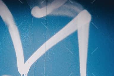Turquoise Wall Texture With White Graffiti Strokes