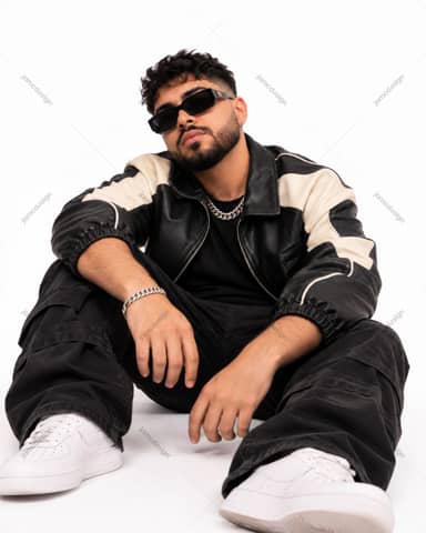 Seated Man In Two Tone Leather Jacket And Sunglasses