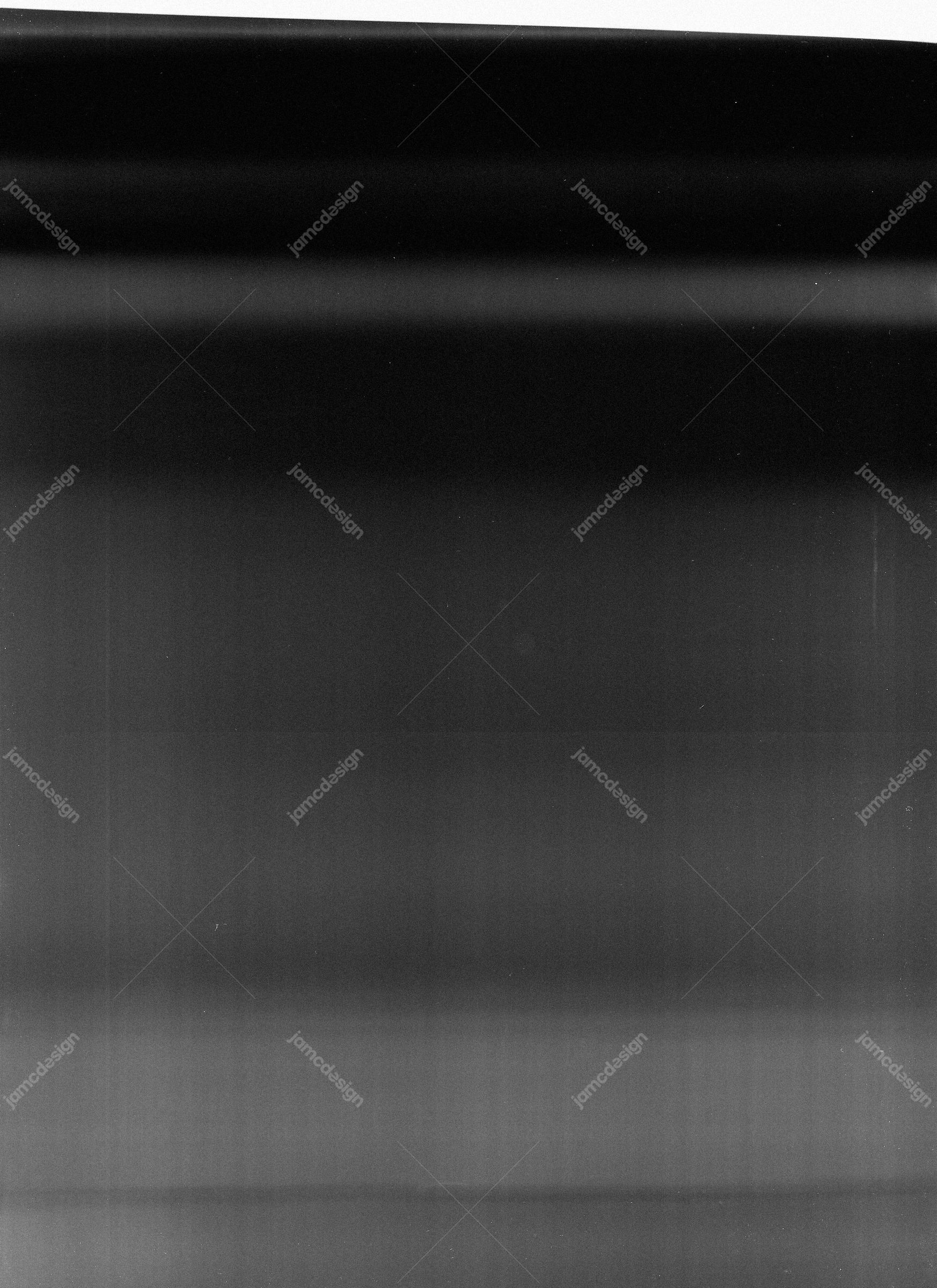 Dark Texture With Horizontal Light Streaks. This JPG texture features soft grey light streaks fading across a nearly black surface