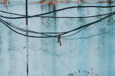 Weathered Aqua Wall Texture With Overhead Cables