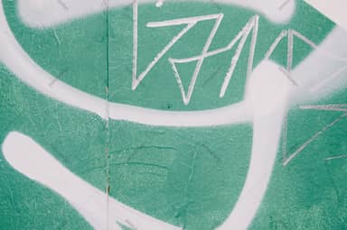 Mint Green Wall Texture With White Graffiti