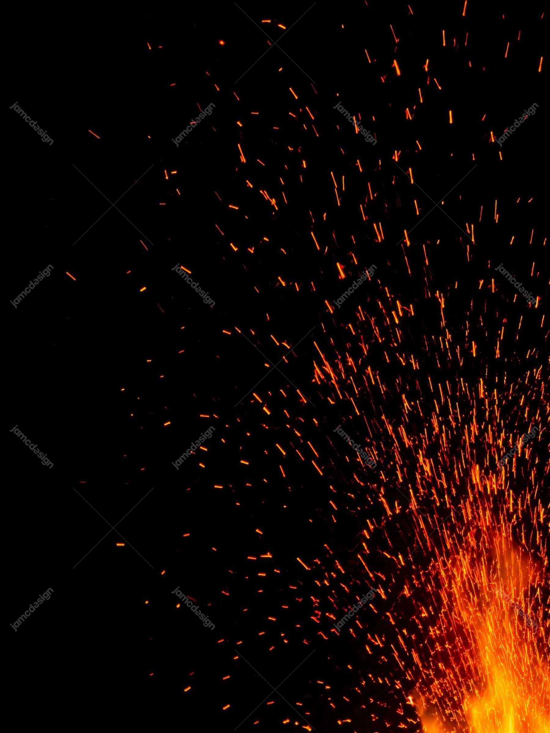 Scattered Orange Sparks On Black Background Texture. JPG texture showing hundreds of bright orange sparks bursting from the lower right against a deep black