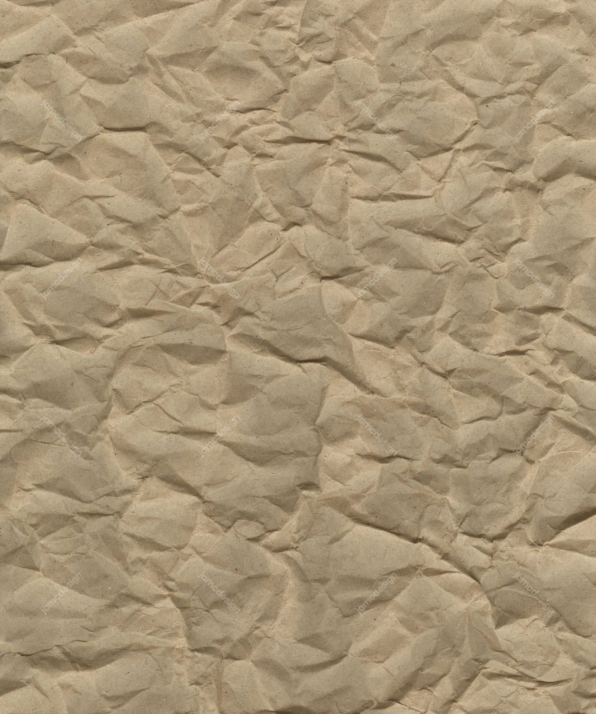 Creased Kraft Paper Background Texture. This beige JPG paper texture shows dense, irregular creases and softly mottled shading across the surface