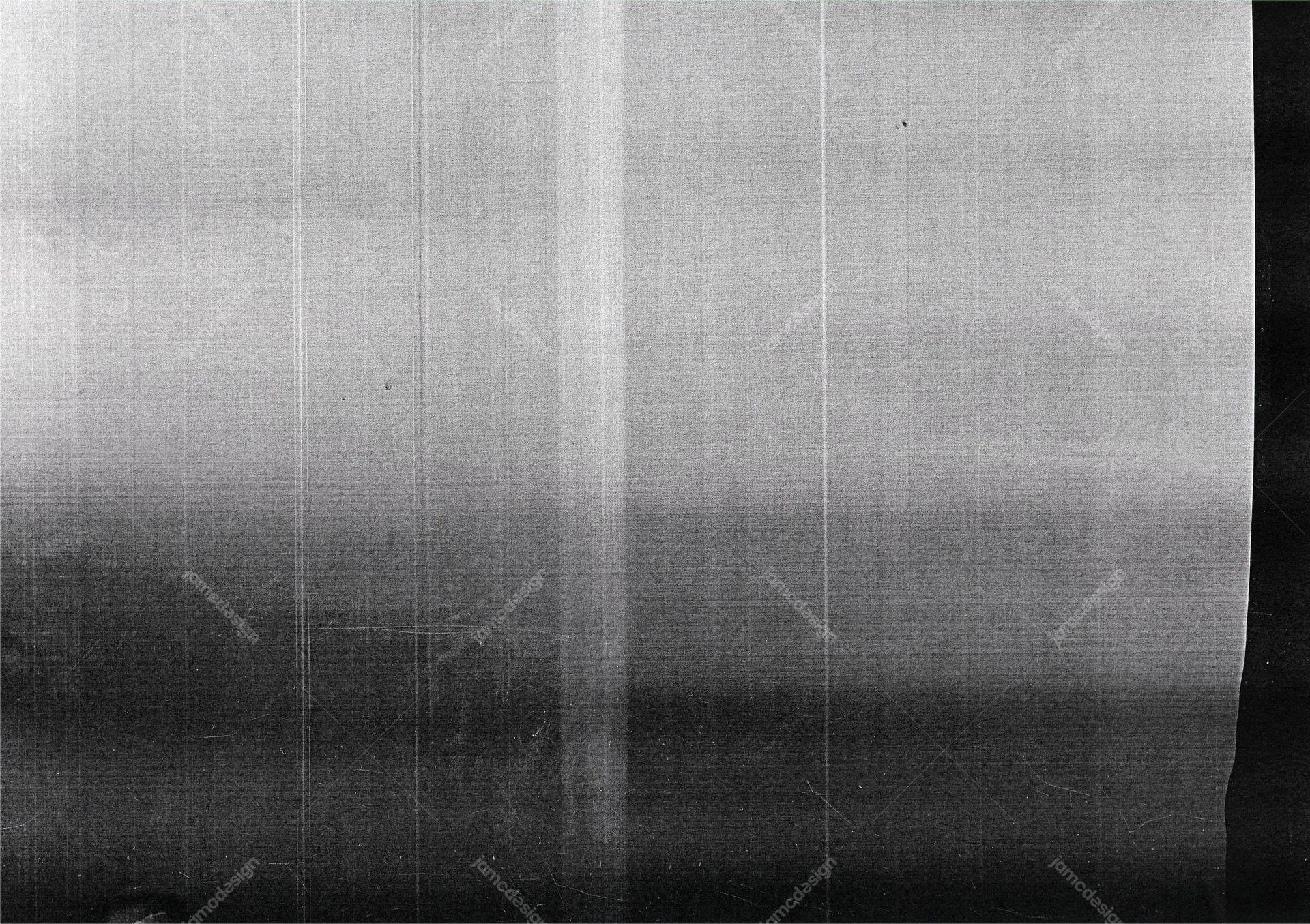 Silver Metallic Grain Texture. This JPG texture presents a monochrome silver surface with fine grain, faint long streaks