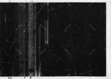 Black Scratched Surface Texture With Pale Edges
