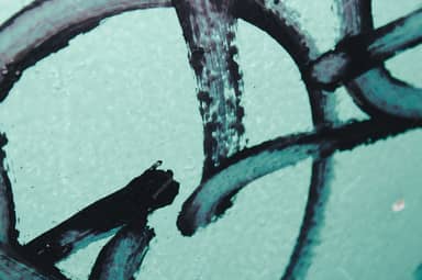 Turquoise Wall Texture With Bold Black Graffiti Strokes