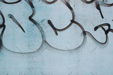 Light Cyan Concrete Texture With Black Graffiti