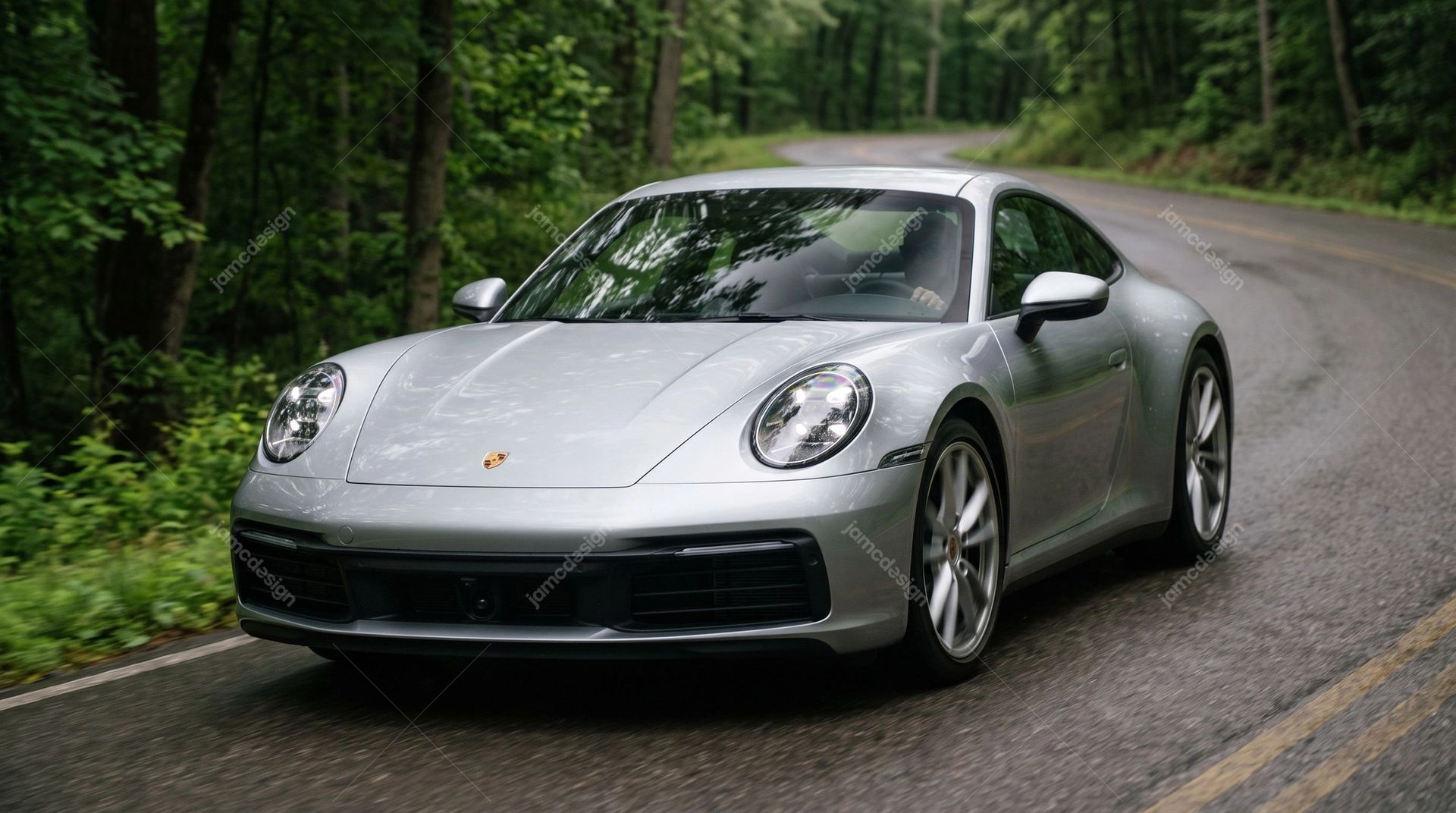 Silver Porsche 911 On Winding Forest Road. This realistic JPG photo shows a silver sports car rounding a winding forest road, framed by dense green trees