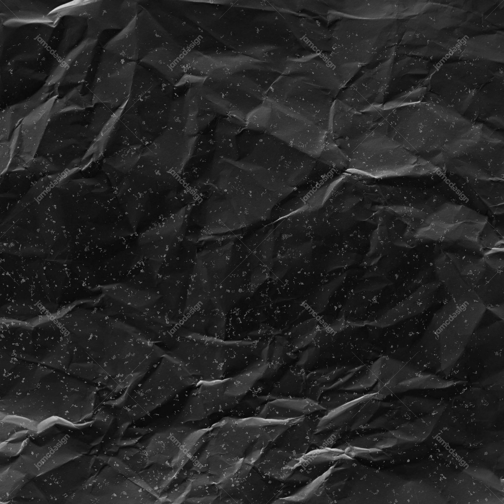 Black Crumpled Paper Texture. This JPG texture shows heavily crumpled black paper with sharp folds, scattered pale flecks and a distressed monochrome surface