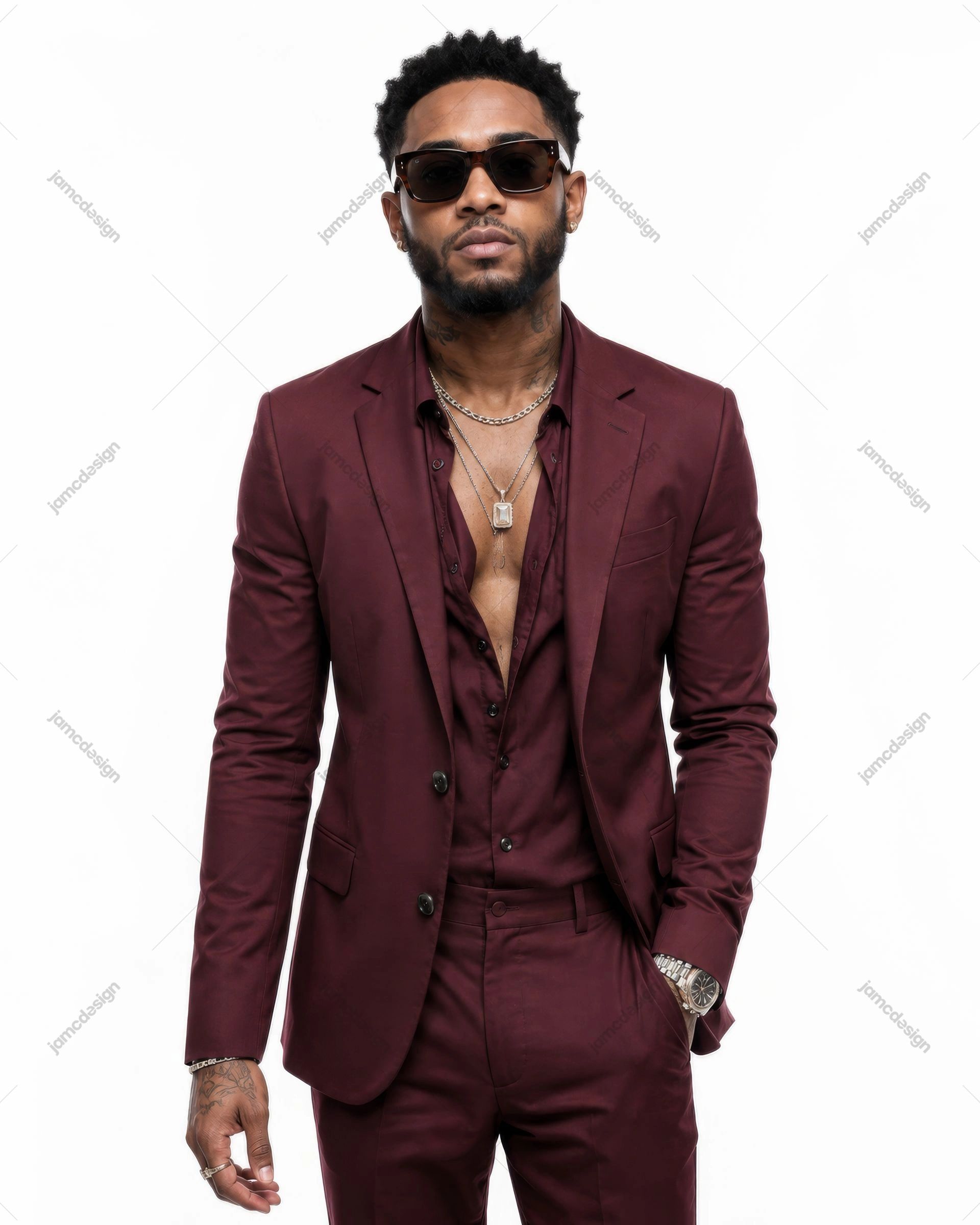 Stylish Black Male Artist In Burgundy Suit And Sunglasses. JPG photo of a stylish man in a burgundy suit, open shirt, layered necklaces and dark sunglasses