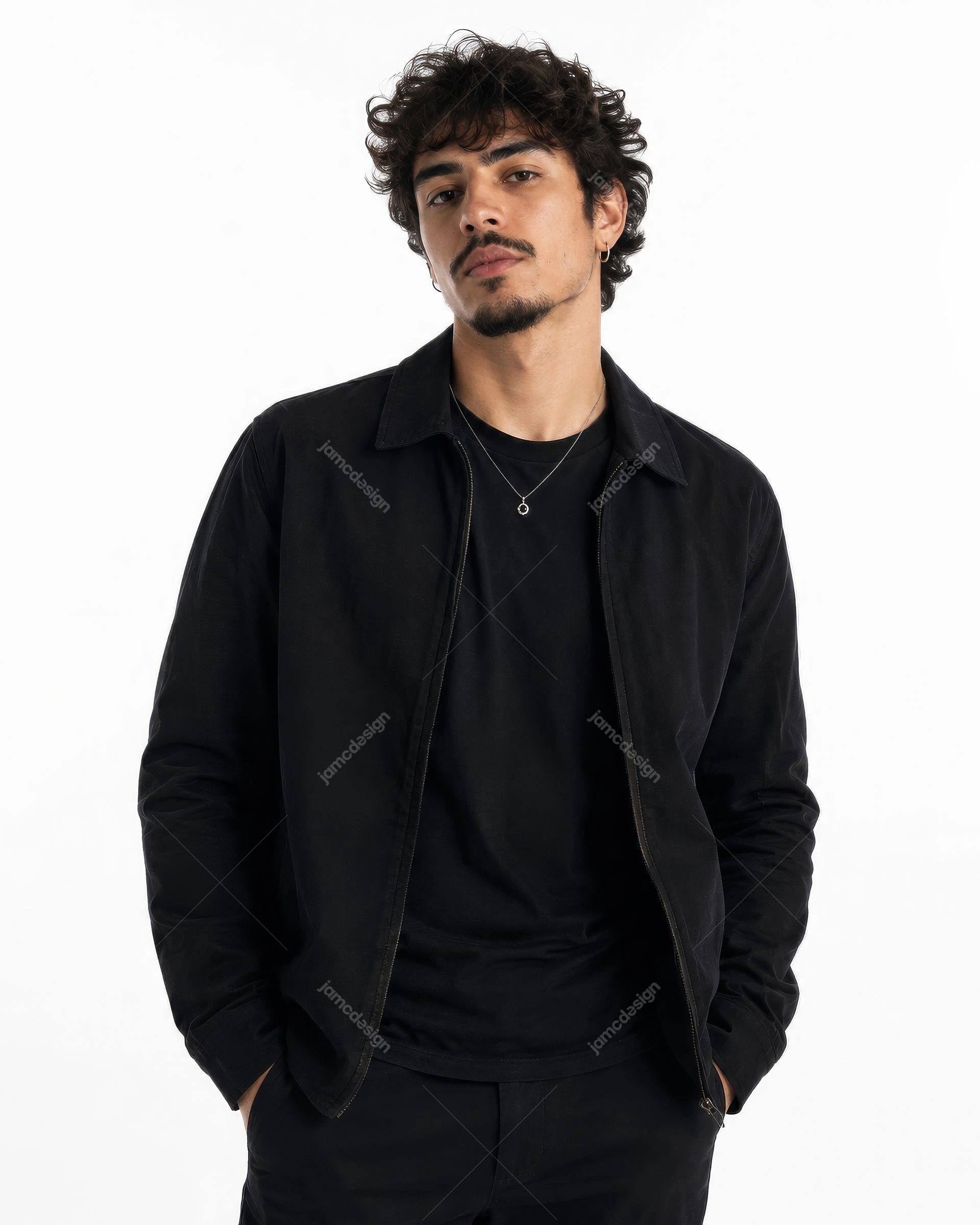 Urban Male Artist Black Outfit Studio Silver Necklace Portrait JPG. JPG photo of a curly haired male model in an all black outfit