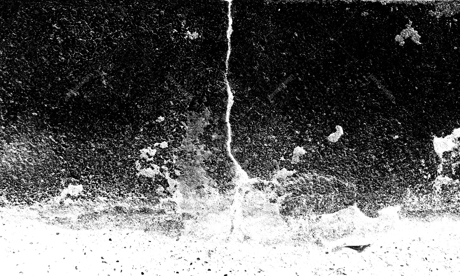Black And White Cracked Surface Texture PNG. This PNG texture shows a rough black and white surface with granular speckling