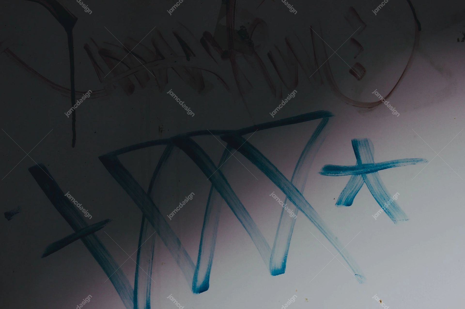 Faded Graffiti On Gray Wall Texture. Download this JPG texture of faded teal graffiti strokes across a gray concrete wall, with a dim