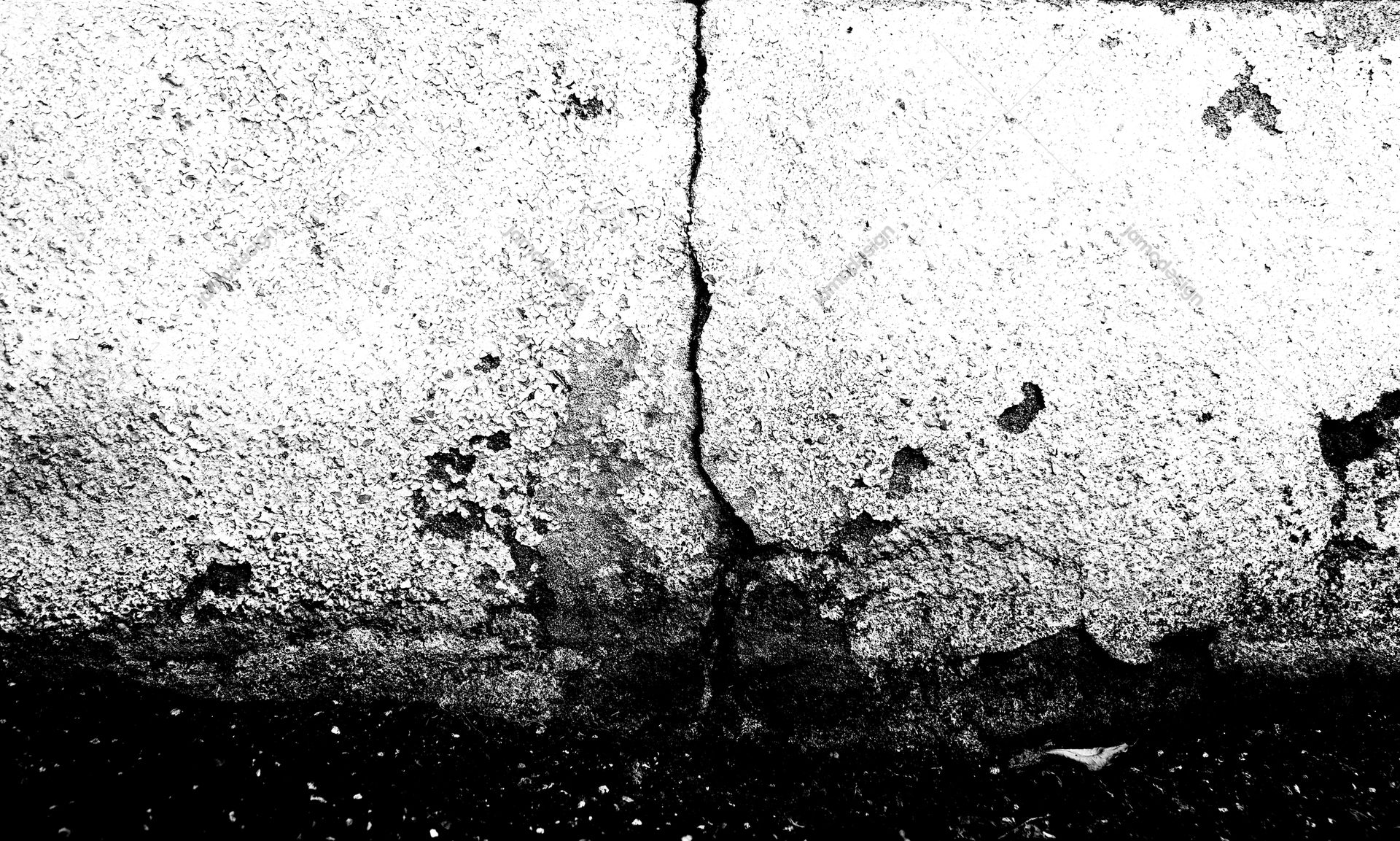 Black And White Cracked Concrete Wall Texture PNG. Download this PNG texture of a cracked concrete wall, rendered in stark black and white with coarse grain