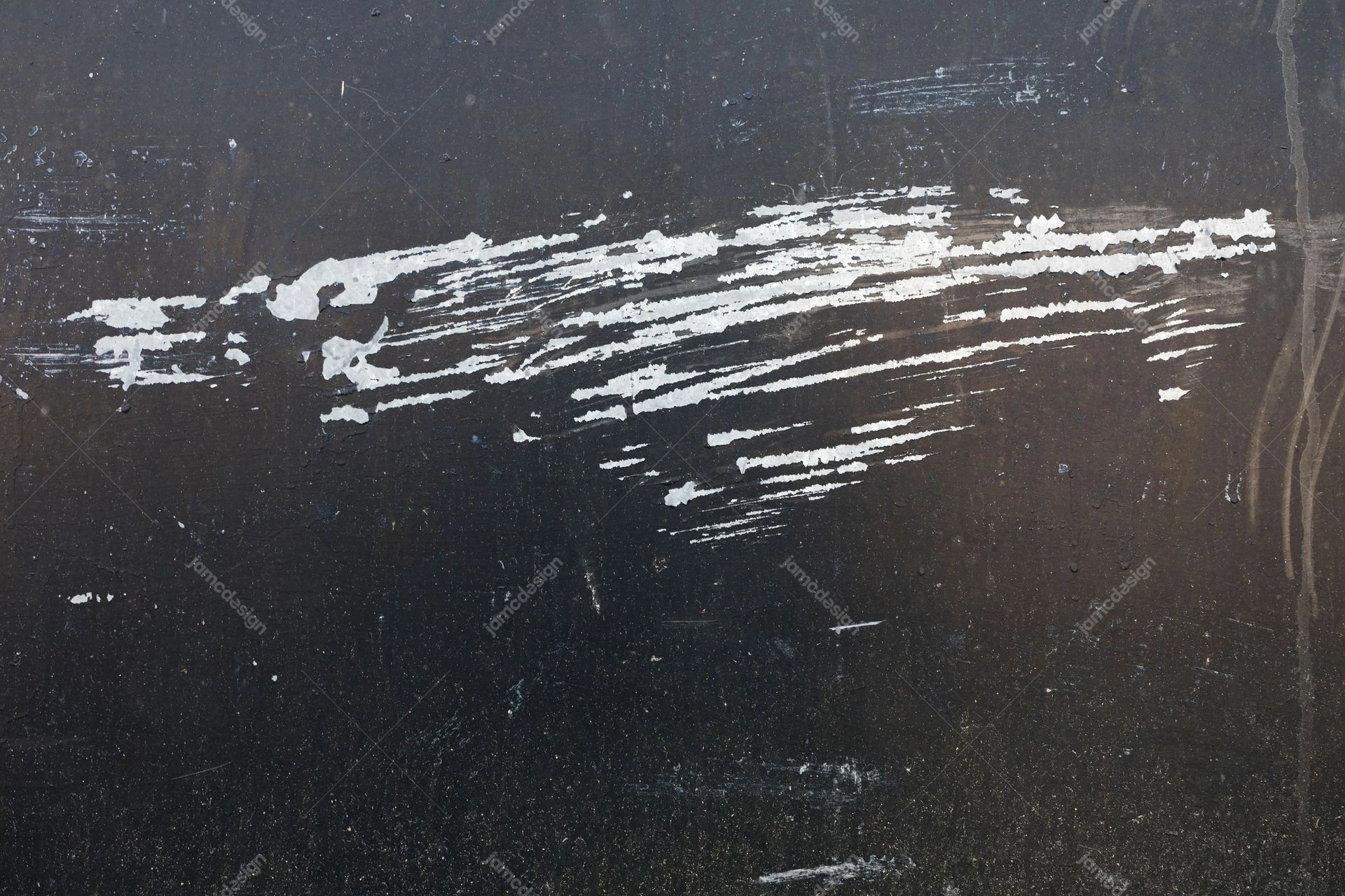 Dark Surface Texture With White Paint Streaks. Download this JPG texture of rough white paint scrape strokes across a dark, scuffed gray surface