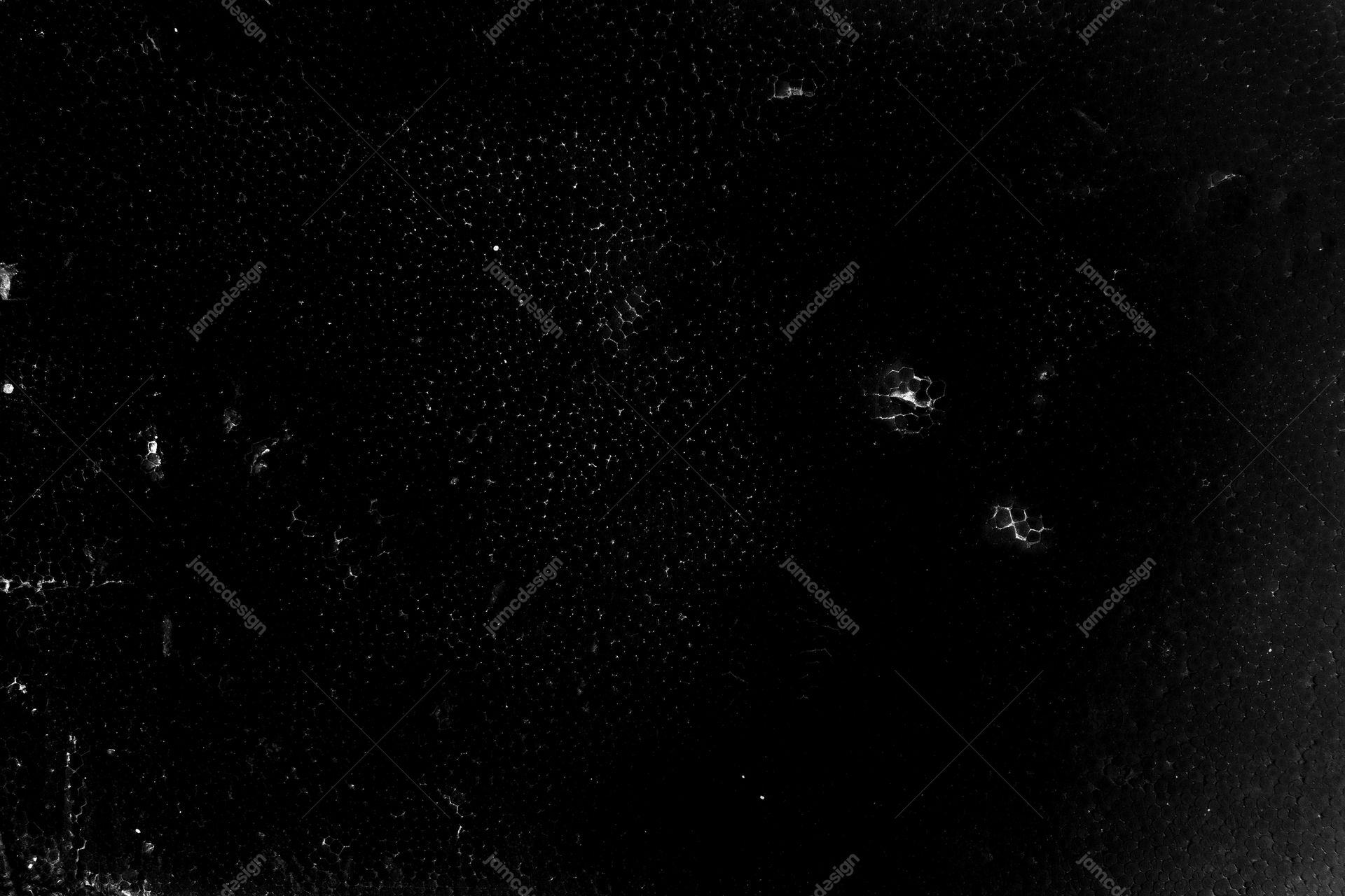 Black Texture With Fine Pale Speckles And Scuffs PNG. This PNG texture has a black, distressed surface scattered with fine pale dust speckles and a few