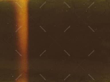 Amber Vertical Light Beam On A Grainy Texture