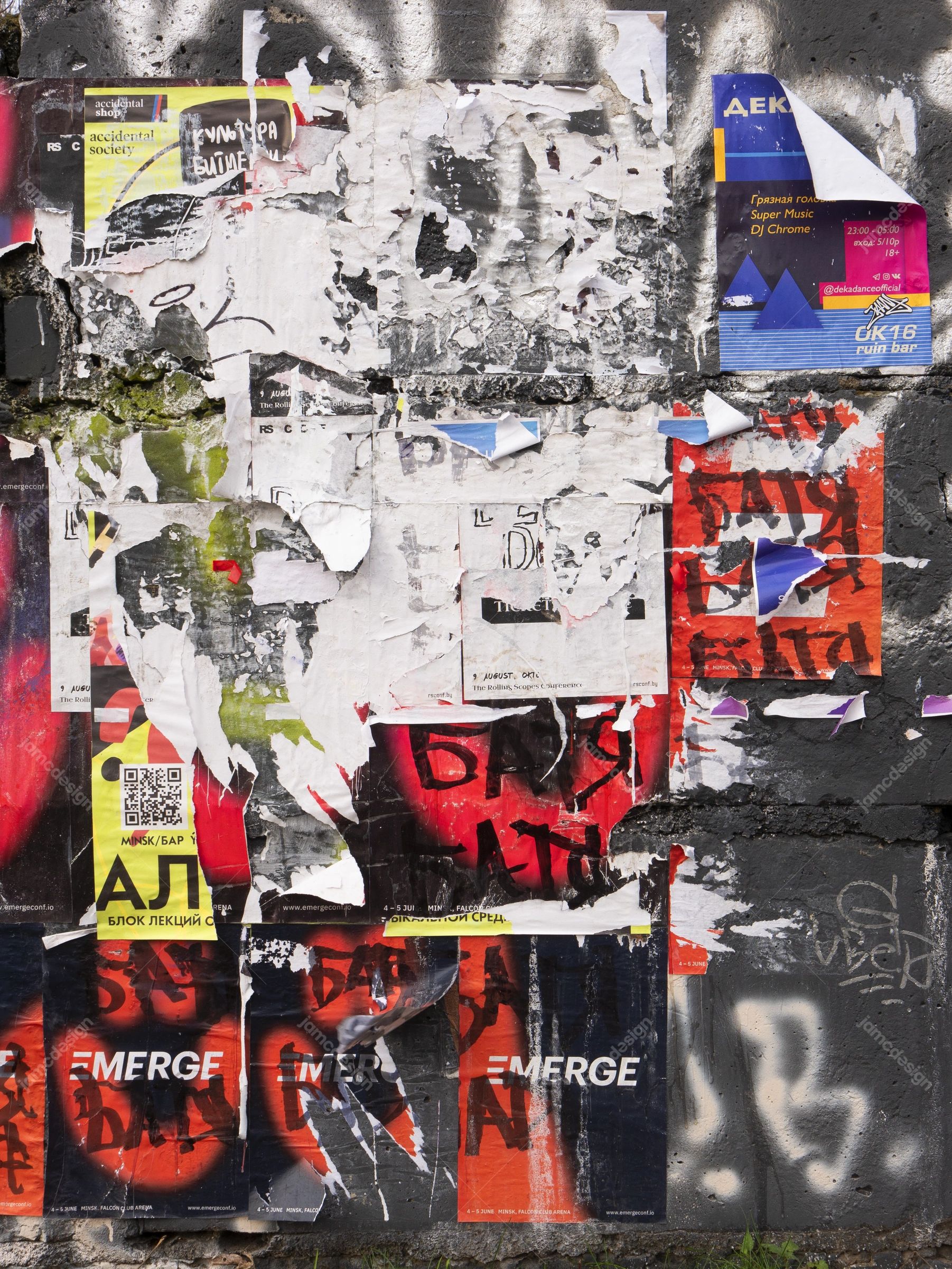 Urban Wall Texture With Overlapping Posters PNG. Download this PNG texture of torn, overlapping paper posters on a rough concrete wall, with weathered paper