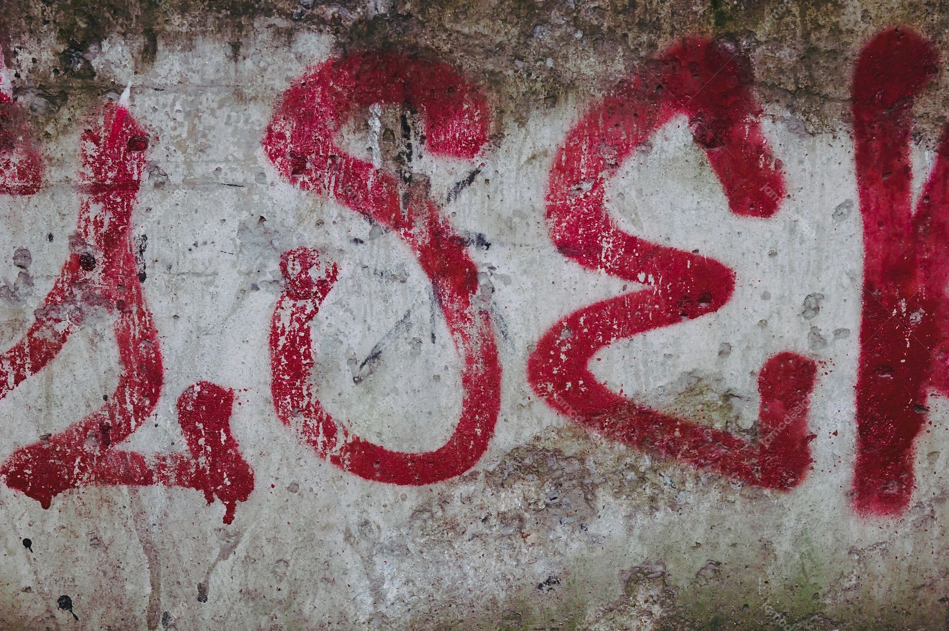 Distressed Concrete Texture With Red Graffiti. This JPG texture shows rough, weathered concrete covered with broad red graffiti strokes and scattered stains