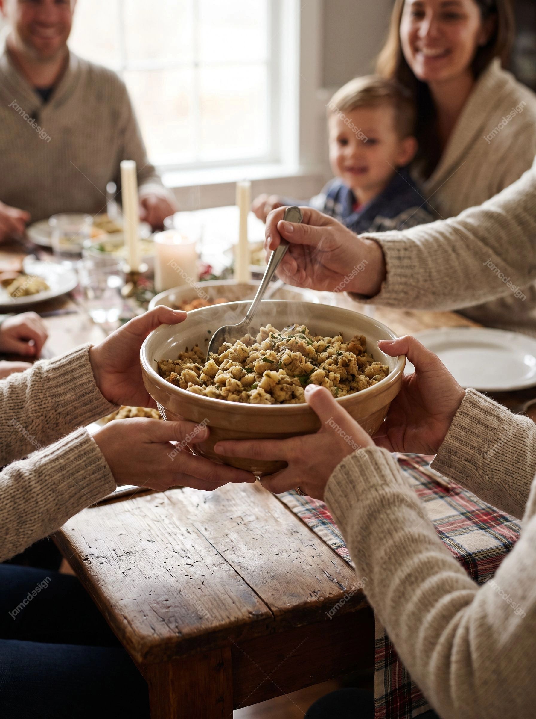 Family Sharing Stuffing At Thanksgiving Dinner. Download this JPG photo of a family sharing a bowl of stuffing at a festive dinner table